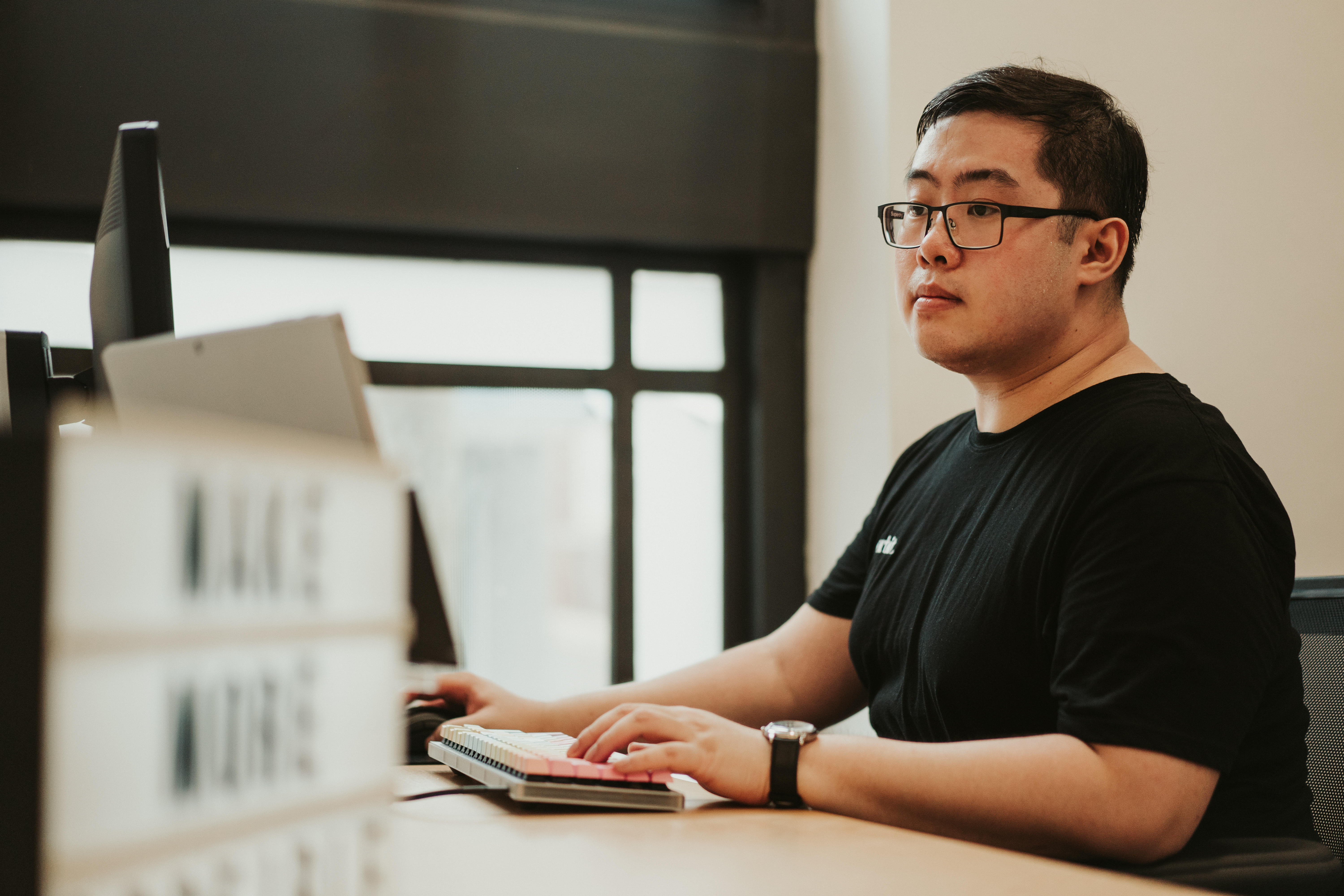 Orbit Team Member Typing On Computer In Sydney Office