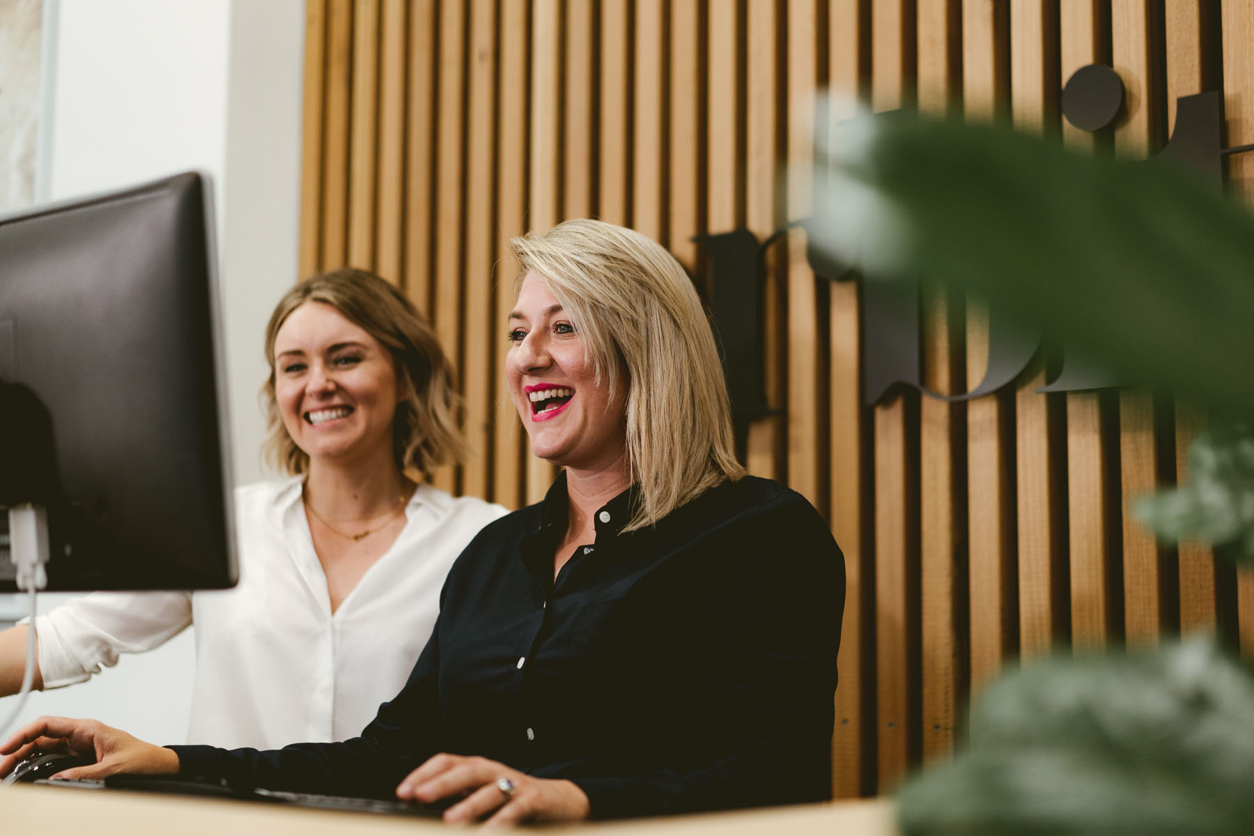 Amelia Carey And Kate Dennis On A Computer In Orbit’s Sydney Office