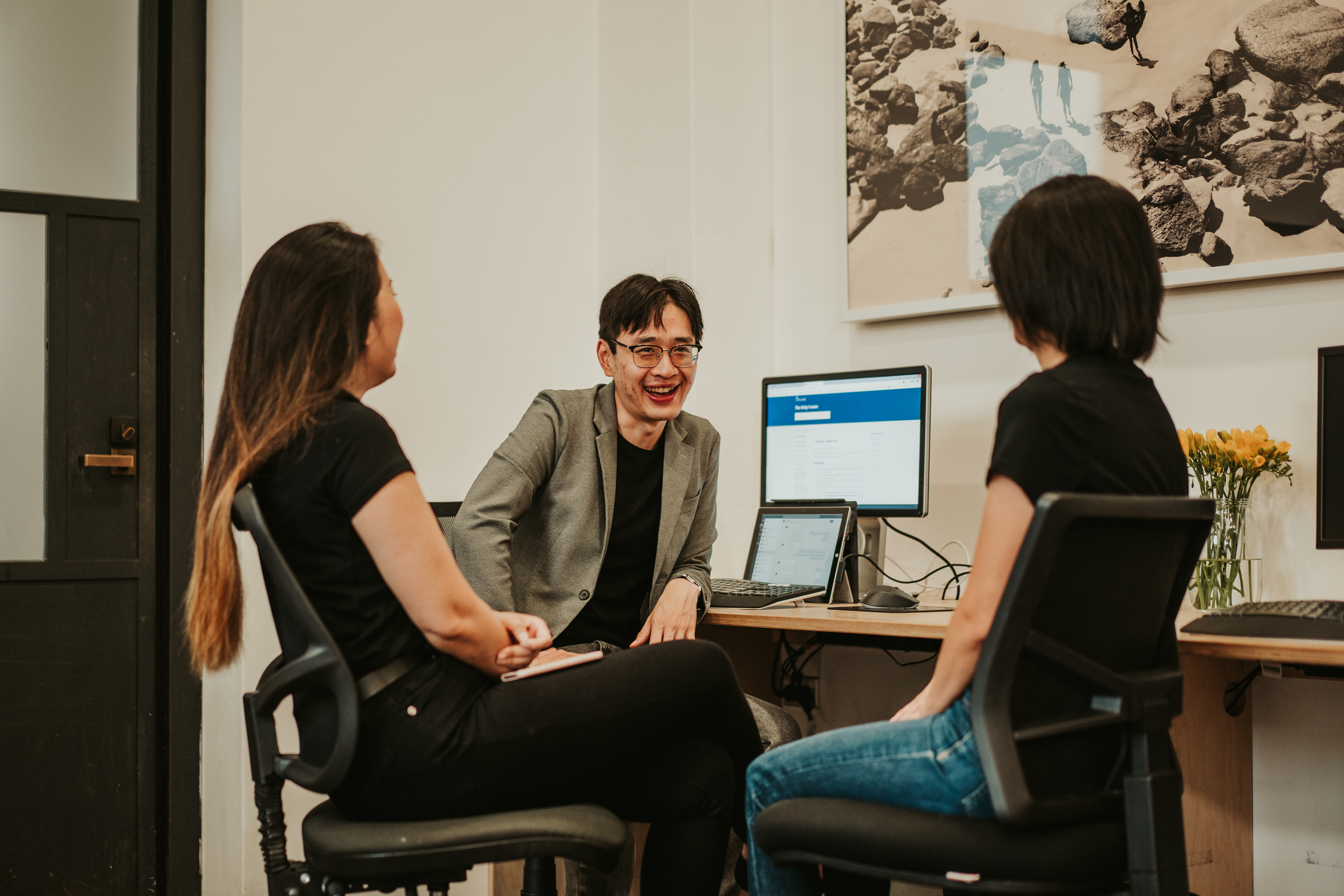 Orbit Team Members Conversing In Sydney Office