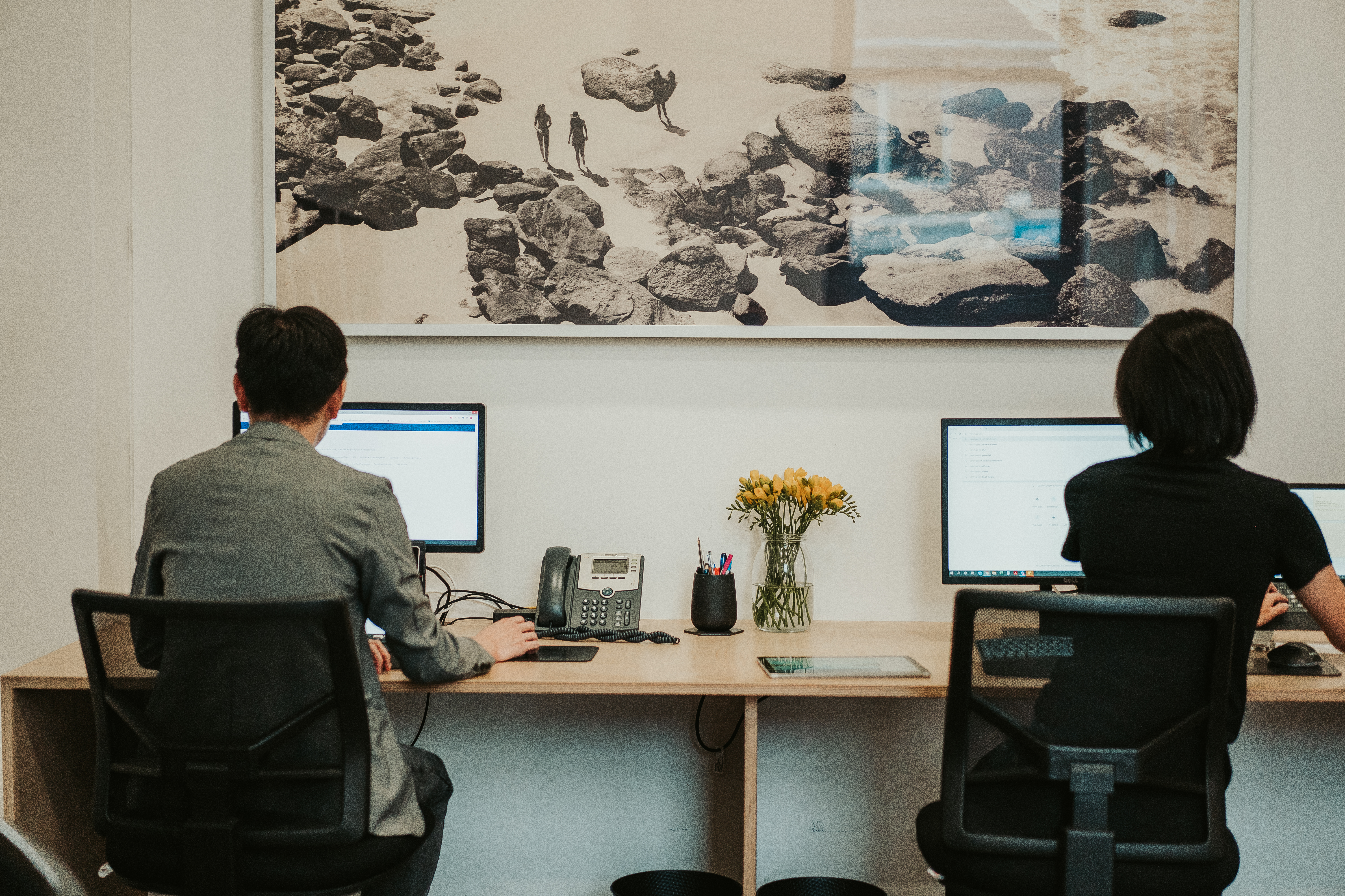 Orbit Accountants At A Desk Working On Financial Reports In Sydney Office