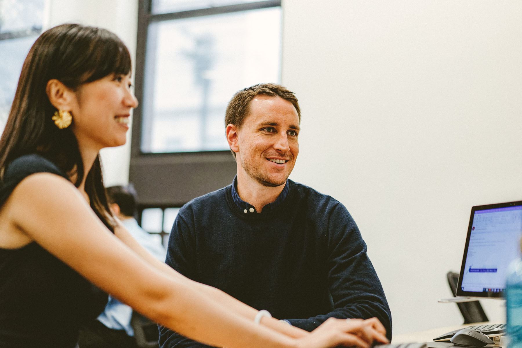 Orbit’s Senior Accountant’s Looking At Computer Screen At Sydney Office