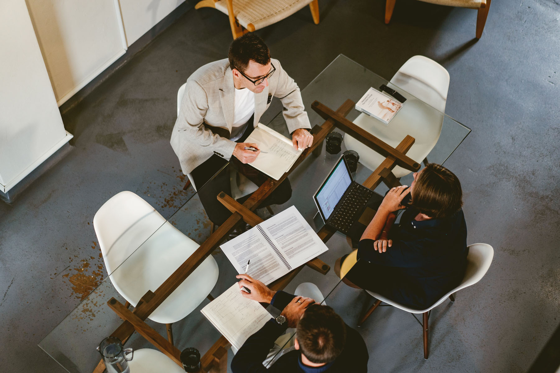 Birdseye View Of Orbit Team Members In Meeting At Sydney Office