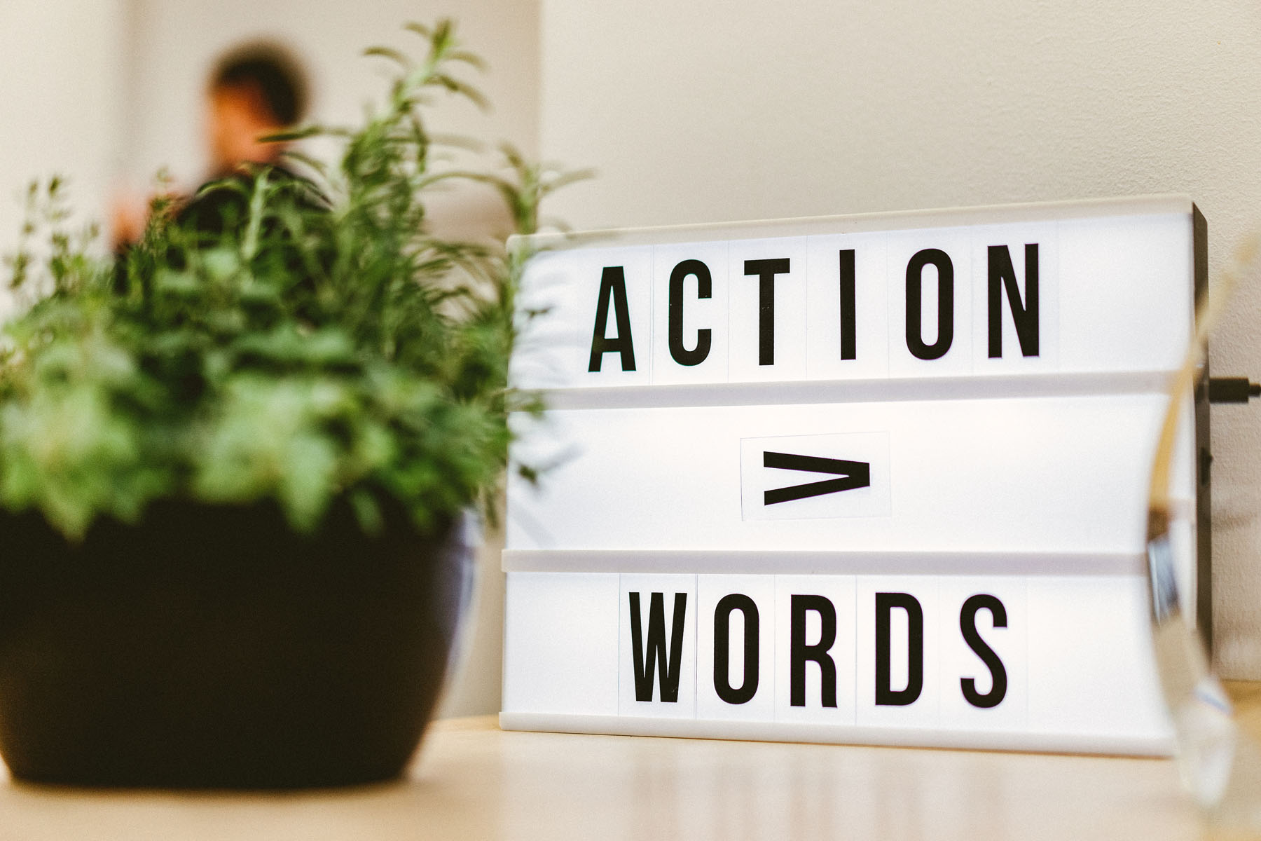 A Sign In Orbit’s Randwick Office Reading ‘action Over Words’