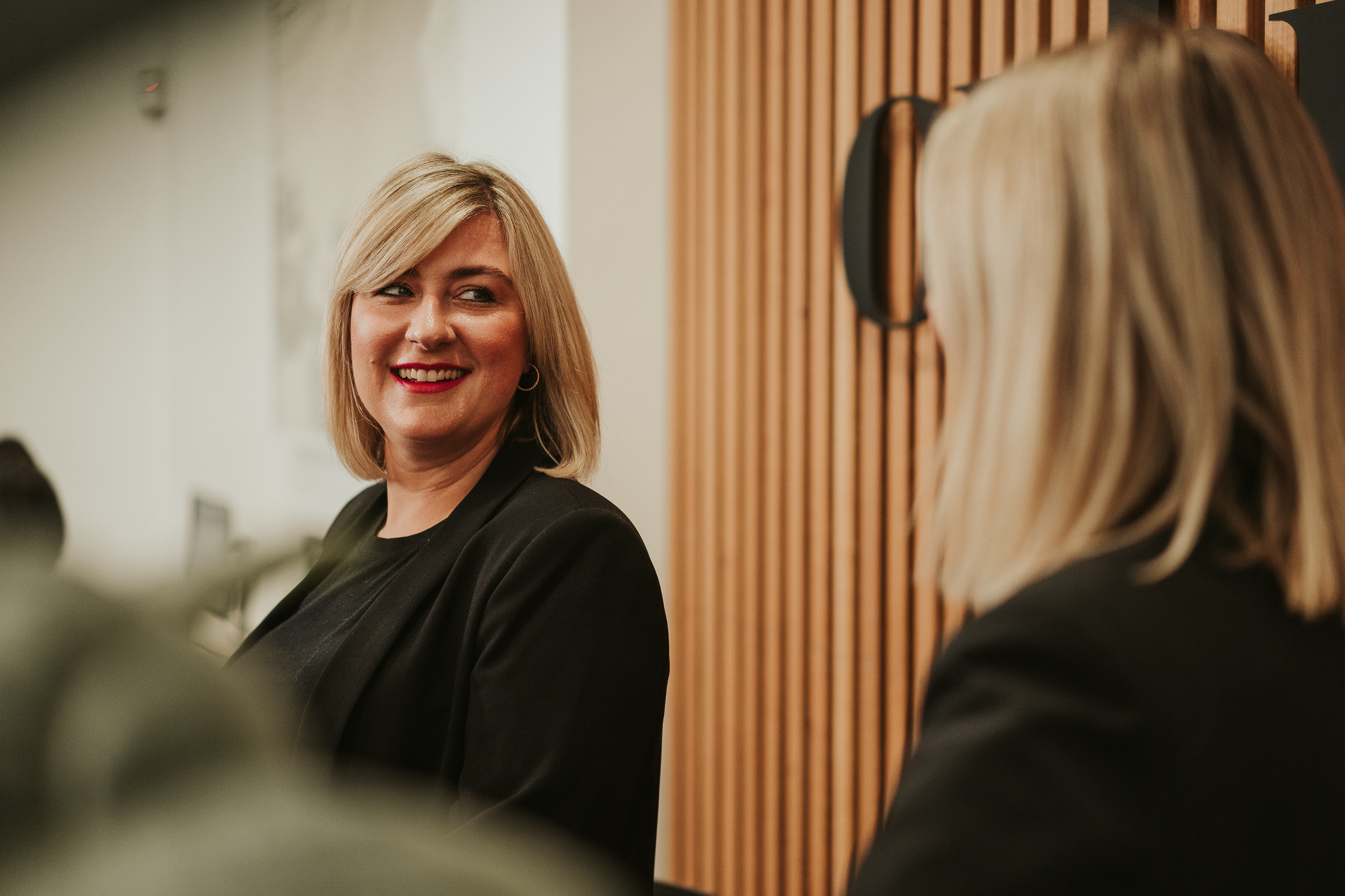Orbit’s Client Manager, Amelia, In The Reception Of Sydney Office Discussing How To Improve Your Profit Margin In 2022