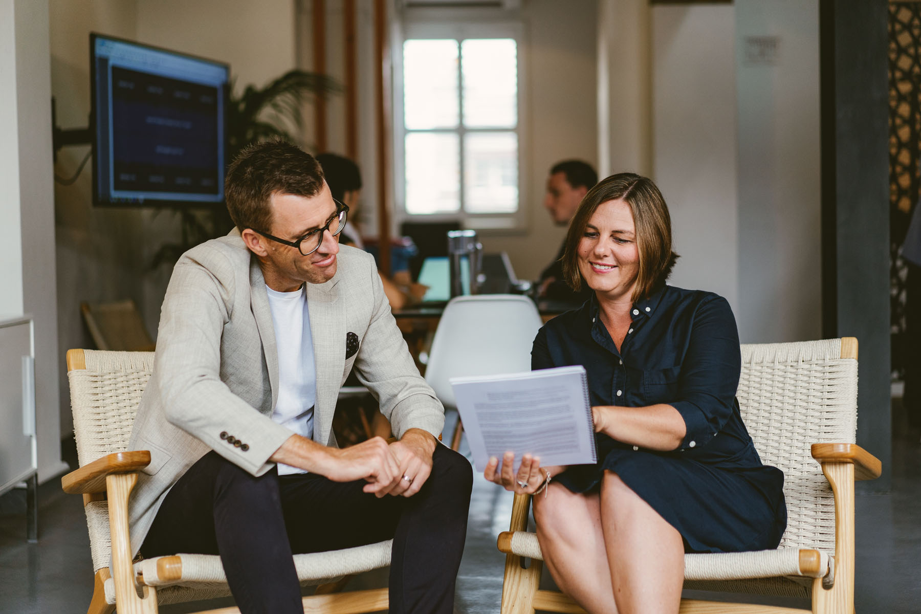 Orbit’s Co Founder, Cpa & Director, Greg Dennis, And Senior Accountant, Rachel, Reviewing Documents In The Meeting Room Of Sydney Office