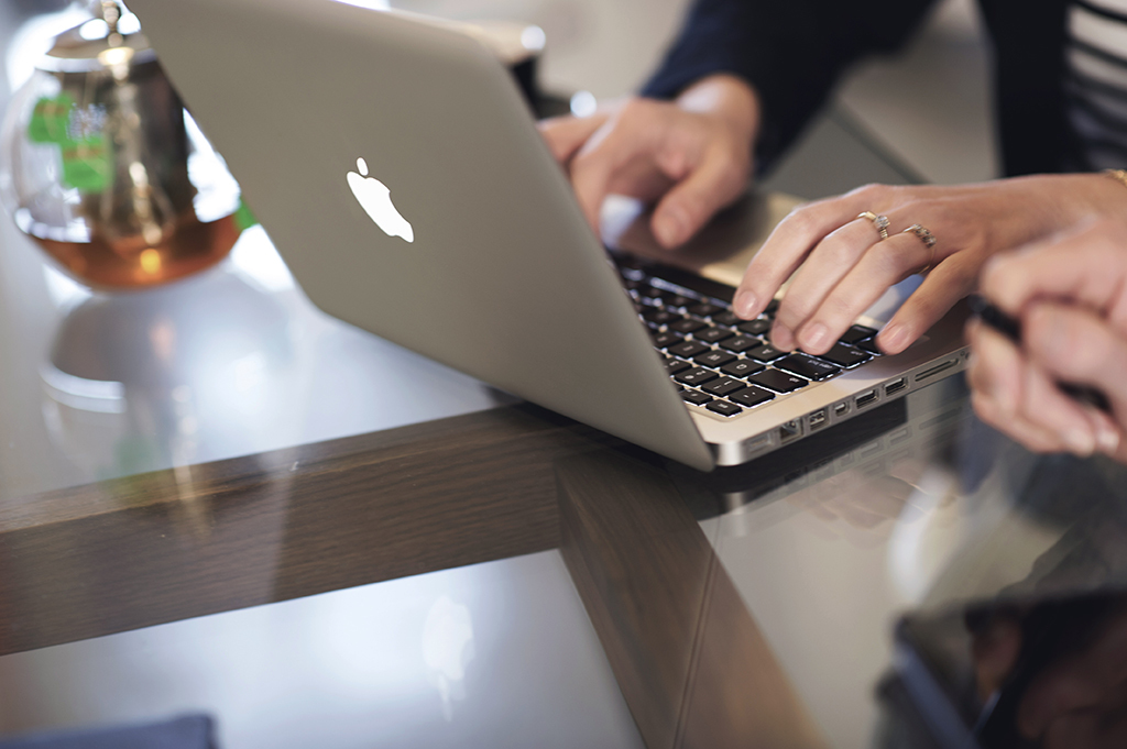 Orbit Team Member Typing On Laptop In Business Meeting At Sydney Office